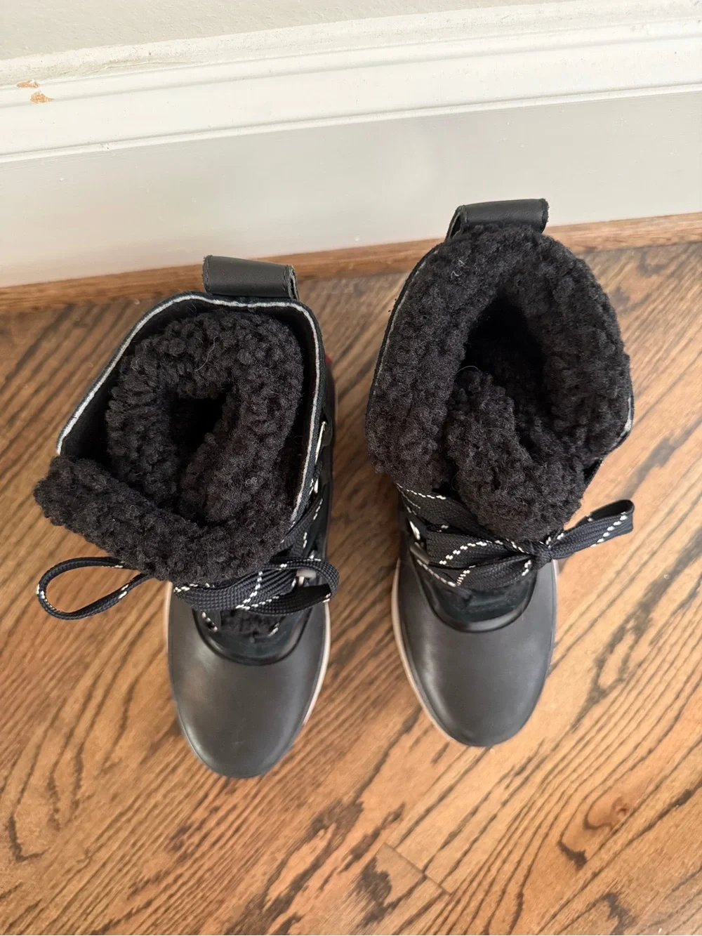 Sorel Explorer Joan Boots Black and White Lace-Up Faux-Shearling Winter Boots
